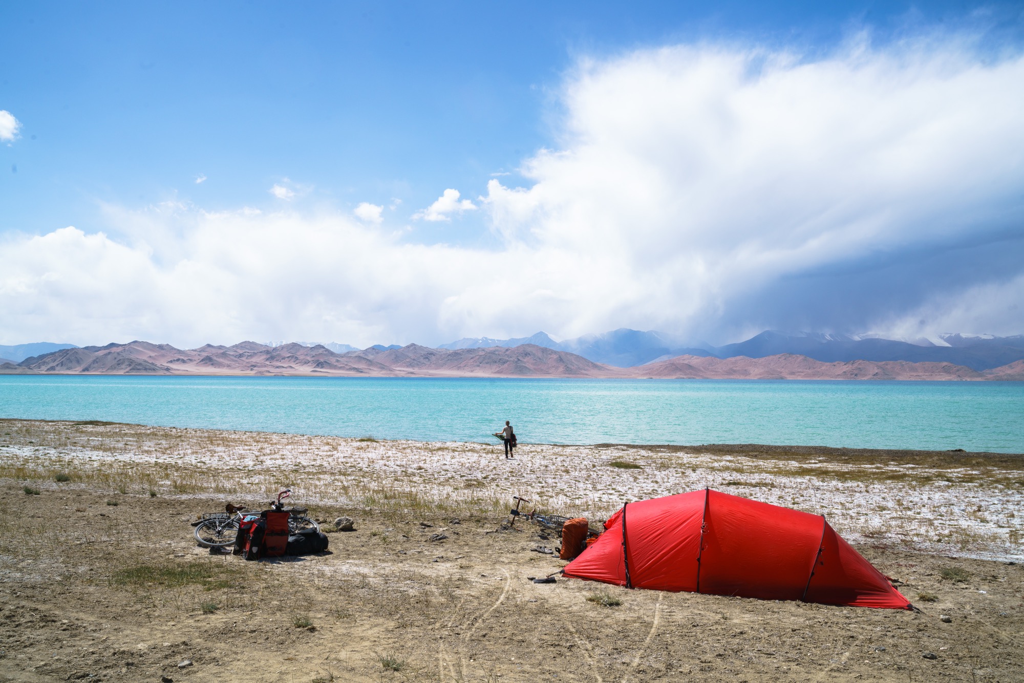 Our new camp spot, with Marcy heading down to the lake to do some laundry